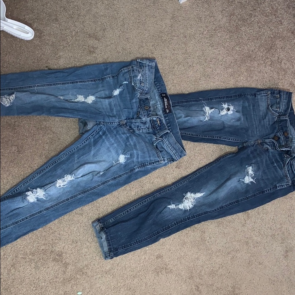 Two pairs of ripped Hollister boyfriend jeans